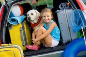 Travel, tourism - Girl with dog ready for the travel for summer vacation
