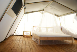 inside a large tent with luxurious furnishings